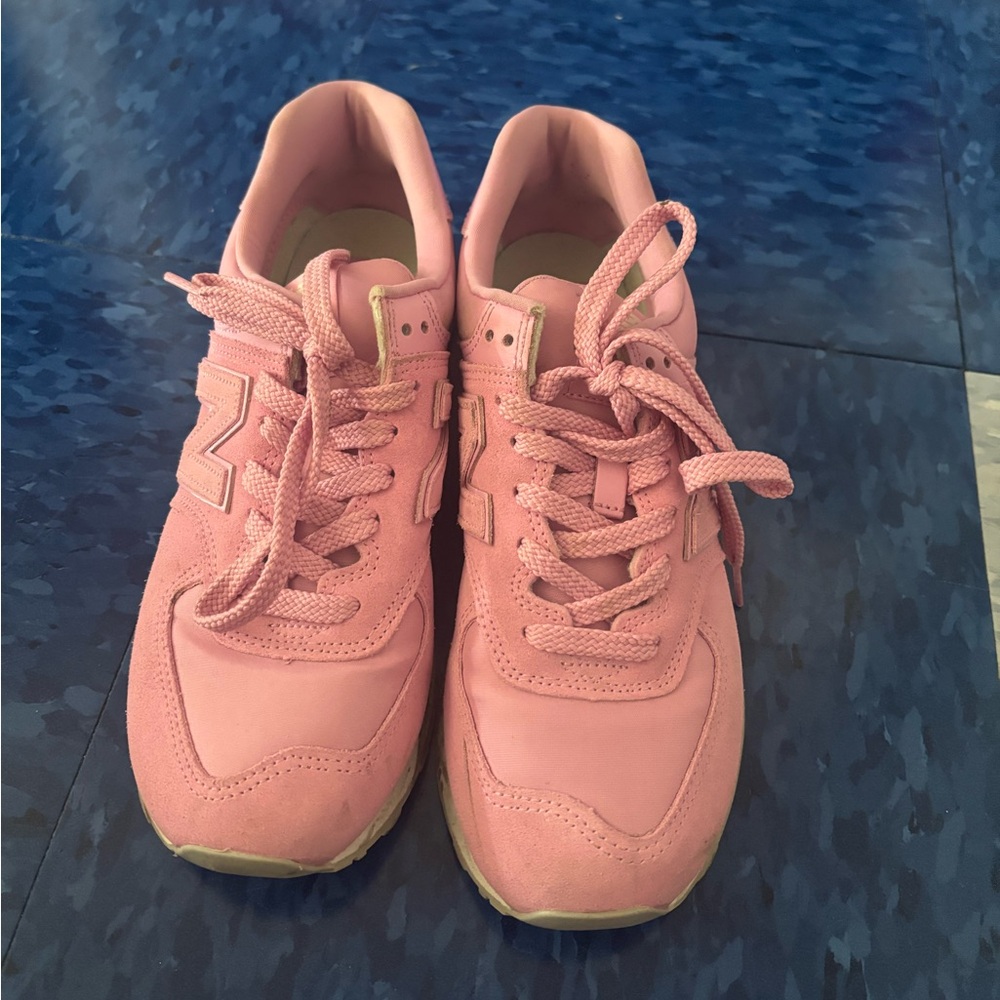 Gently used pink new balance sneakers.